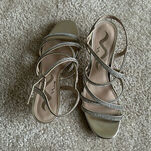 Formal, gold sandal with rinestones. 1 1/2 inch heel, worn one time